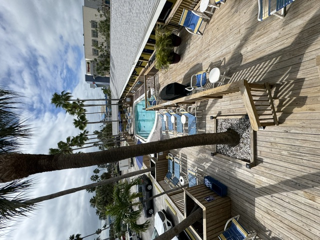 The pool deck and waterfront grounds at Barefoot Bay Resort